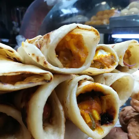 Stacked kathi rolls with filling showing (opens Instagram in a new tab)